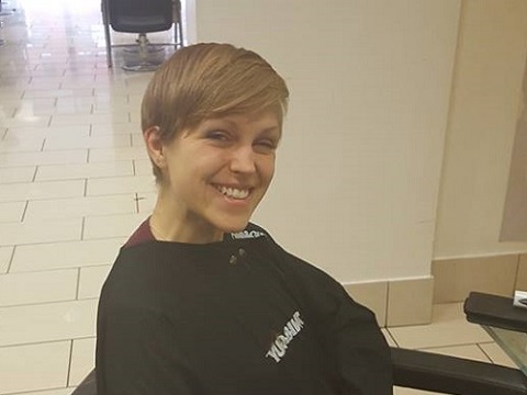 Emma shows off her new hairstyle after she cut her hair to raise money for Porridge and Rice