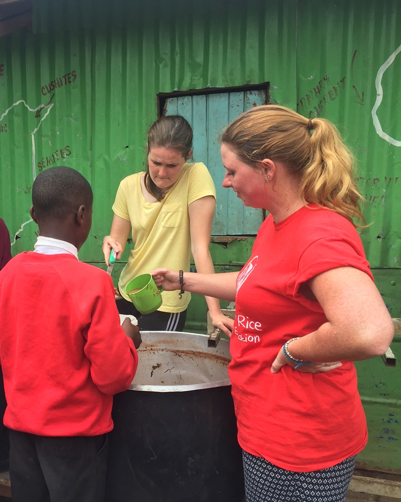 trainee nurses doing their elective with Porridge and Rice helping to serve breakfast