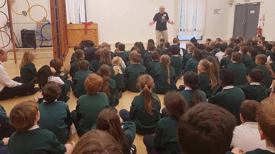 Ken Surridge chair of the charity Porridge and Rice talks to the school about life in the Nairobi slums
